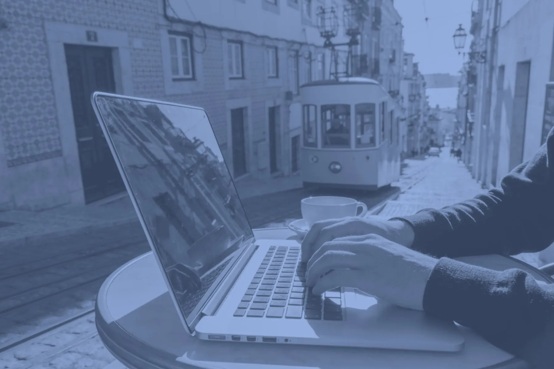 Someone working on a laptop in Portugal